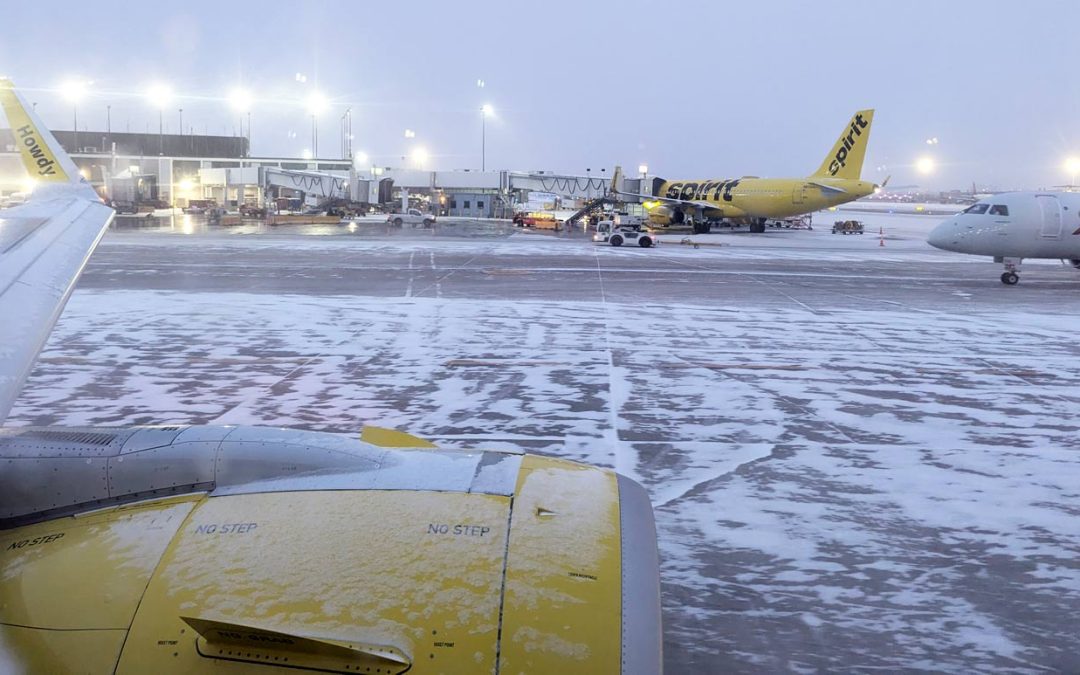 Spirit airlines plane next to the Gate in O'Hare airport